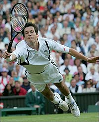 Henman dives at the net