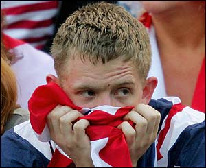 A nervous fan watches Henman in action