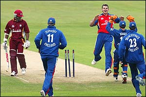 England's James Anderson celebrates taking the wicket of Brian Lara for six