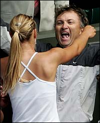 Sharapova makes the customary climb up to the players' box to celebrate her historic win with her father Yuri