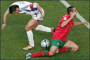 Greece's Theodoros Zagorakis challenges Pauleta 