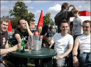 A group of friends sit quaff bubbly at the champagne bar