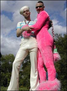 Two men wear bright outfits