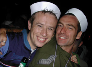 Two men wearing sailor hats