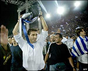 Team captain Theodoros Zagorakis lifts the trophy