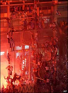 Thousands of Greek fans celebrate in Omonia Square, central Athens, early on Monday