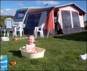 Thomas Pickup enjoying his bath at Tan-y-Llan caravan site, Tudweiliog, Gwynedd