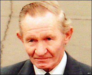 Charles Robert Jenkins sees off his wife at Pyongyang airport in October 2002