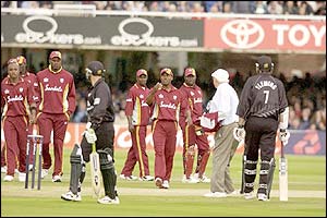 Brian Lara calls New Zealand's Nathan Astle back to the crease