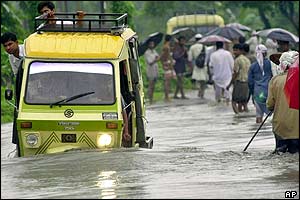 Trishaw in flooded waters in Kamalpur, Assam