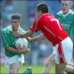 Cork's Martin Cronin challenges Mark Little of Fermanagh