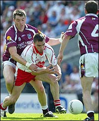 Sean O'Domhnaill of Galway challanges Ryan McMenamin of Tyrone