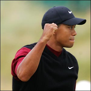 Tiger Woods celebrates after getting a birdie at the fifth