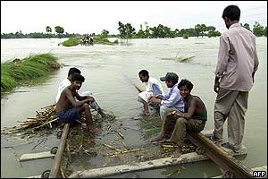 Residents besides submerged railway track in Bihar