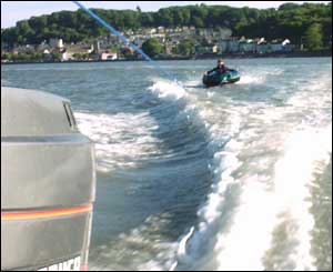 Kate Williams of Neath being towed behind a boat in Swansea Bay (Matthew Williams)