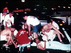 Passers-by help the injured at Centennial Park