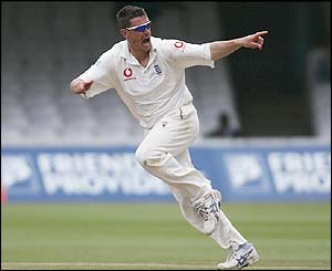 Ashley Giles takes the wicket of Lara
