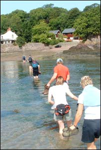 The Carmarthen Sartorius gym club on a walk in Pembrokeshire on stepping stones at Sandy Haven (Chris Jones)