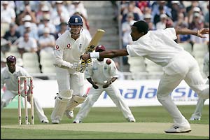 Corey Colleymore bowls to England opener Marcus Trescothick
