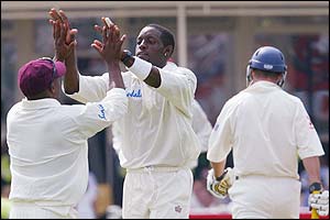 Brian Lara congratulates Jermaine Lawson the dismissal of England's Andrew Strauss 