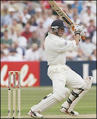 Geraint Jones sends the ball away for four