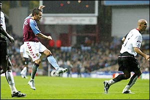 Lee Hendrie scores to secure the points for Villa