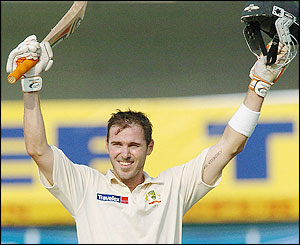 Damien Martyn acknowledges the crowd as he reaches 100
