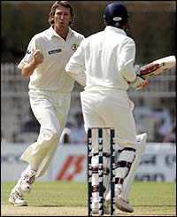 Glenn McGrath celebrates the wicket of Virender Sehwag