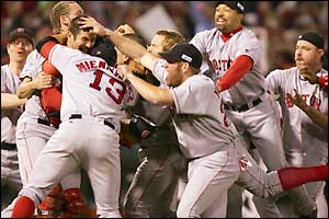 Boston's players celebrate after Keith Foulke claims the final out