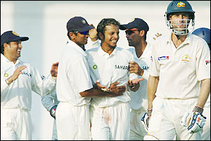 Murali Kartik celebrates with his team after getting Simon Katich out but India are in deep trouble 