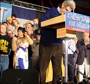 Michaela Fishback presents a card to John Kerry, at a rally in Waterloo, Iowa.