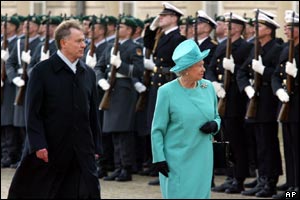 The Queen reviews a tri-service guard of honour in front of Berlin's Schloss Charlottenburg presidential palace with German president, Horst Koehler 
