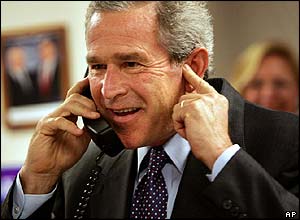The President answers the telephone during his visit to the Ohio Bush/Cheney campaign headquarters in Columbus, Ohio
