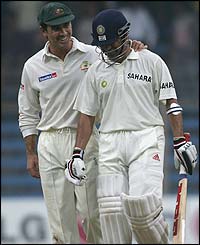 Australia's Justin Langer shares a joke with Sachin Tendulkar 