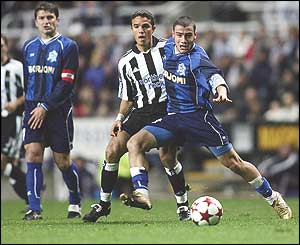 Laurent Robert of Newcastle United and Jaba Kankava of Dinamo Tbilisi tussle for the ball