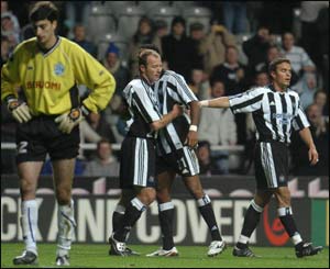 Alan Shearer celebrates after scoring 