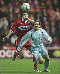 Stewart Downing of Middlesbrough is challenged by Antonio Filippini of Lazio