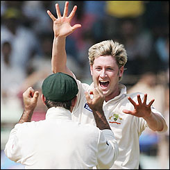 Clarke celebrates with captain Ricky Ponting as India struggle to 199-9