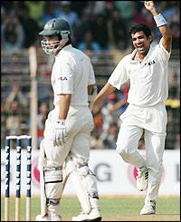 Zaheer Khan is happy to get the wicket of Justin Langer