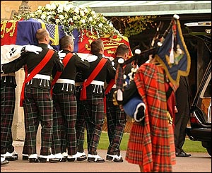 Coffin being put into the hearse