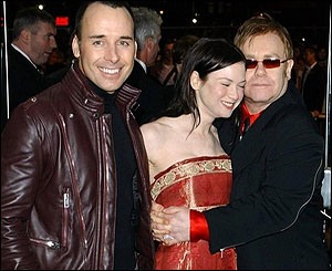 Renee Zellweger, Sir Elton John, and David Furnish. 
