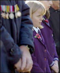 Elizabeth Phillips, nine, from St John's School, stood silent during a ceremony in Ipswich.