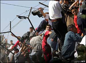 People try to climb over compound wall