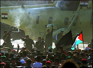 Police drive back crowd from helicopter