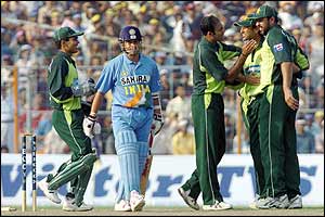 Indian talisman Sachin Tendulkar is run out and returns to the pavilion with the score on 29