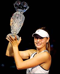 Maria Sharapova lifts the championship trophy