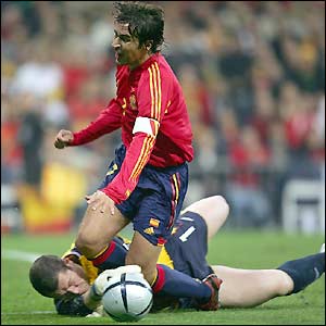 Spain are awarded a penalty as Raul appears to trip following Paul Robinson's challenge