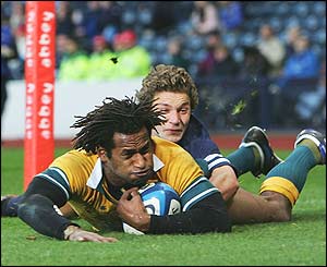Lote Tuqiri of Australia scores the first try of the match