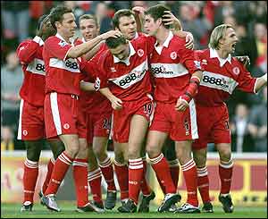 Boro players congratulate Riggott on his goal