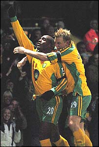 Francis (left) is congratulated by teammate Svensson after his second goal